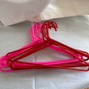 10 red and pink plastic hangers gently used condition